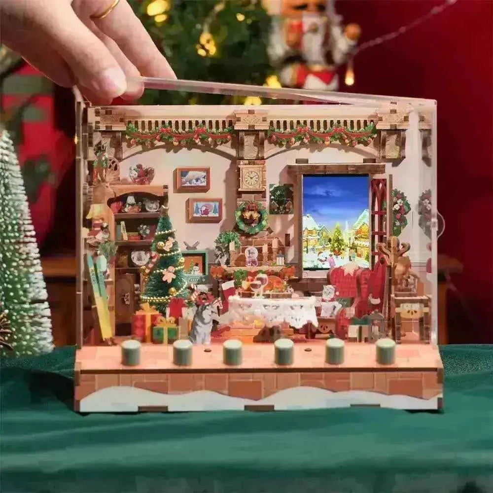 DIY 3D wooden Christmas book nook kit with festive interior, tree, gifts, and holiday decor